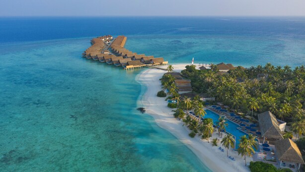 An aerial view of a resort with overwater bungalows, a beach, and a pool area. - Emerald Faarufushi Resort & Spa (Faarufushi)