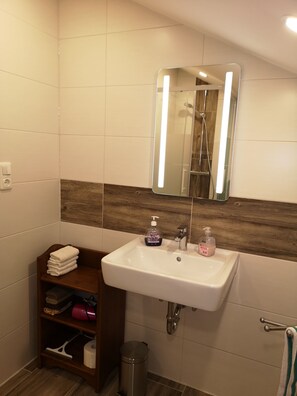 Shower, hair dryer, towels, soap