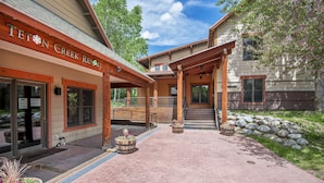 A building with a sign reading "TETON CREEK RESORT". - Recreation Headquarters! National Parks! Hot Tubs & Gym! On Teton Creek! Clean! (Driggs)