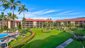 A resort with multiple-story buildings, a pool, and a well-maintained lawn. - Stunning Ocean Views From Highly Upgraded 2 Bedroom Condo: Papakea K303 (Lahaina)