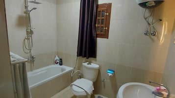 Designer toiletries, hair dryer, slippers, bidet