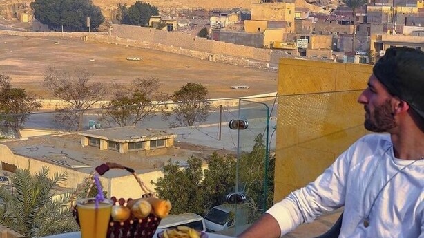 A table with food and a view of a pyramid. - Sphinx Safari (Giza)
