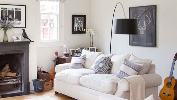 A cozy living room with a fireplace, a sofa set, a coffee table, and a guitar. - Beautiful house in Lee's Summit (Lee's Summit)