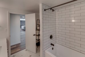 Combined shower/tub, hair dryer, towels, soap