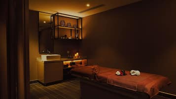 Relax in a serene space with a large bed, bedside table, and shelf.
