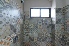 Shower, towels, soap, toilet paper