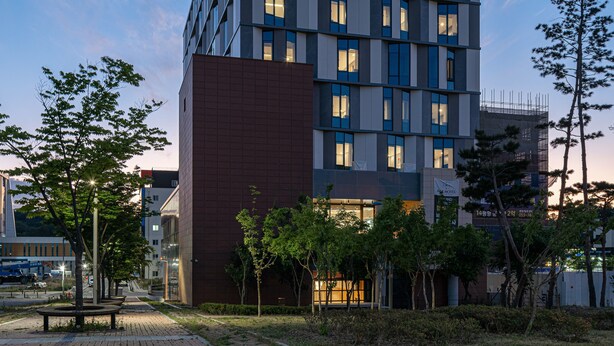 A modern hotel building with multiple floors and a sign that reads "ACT HOTEL". - ACT Hotel (Daegu)