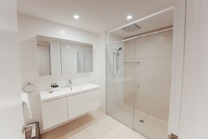Executive Retreat with Water Views | Bathroom | Shower, designer toiletries, hair dryer, towels