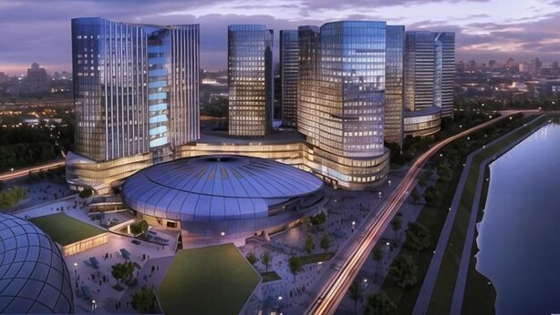 A modern building complex with multiple high-rise structures, a central circular plaza, and surrounding greenery. - Mellow Crystal Hotel (Zhangjiajie)