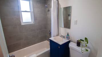 Combined shower/tub, hair dryer, towels, soap