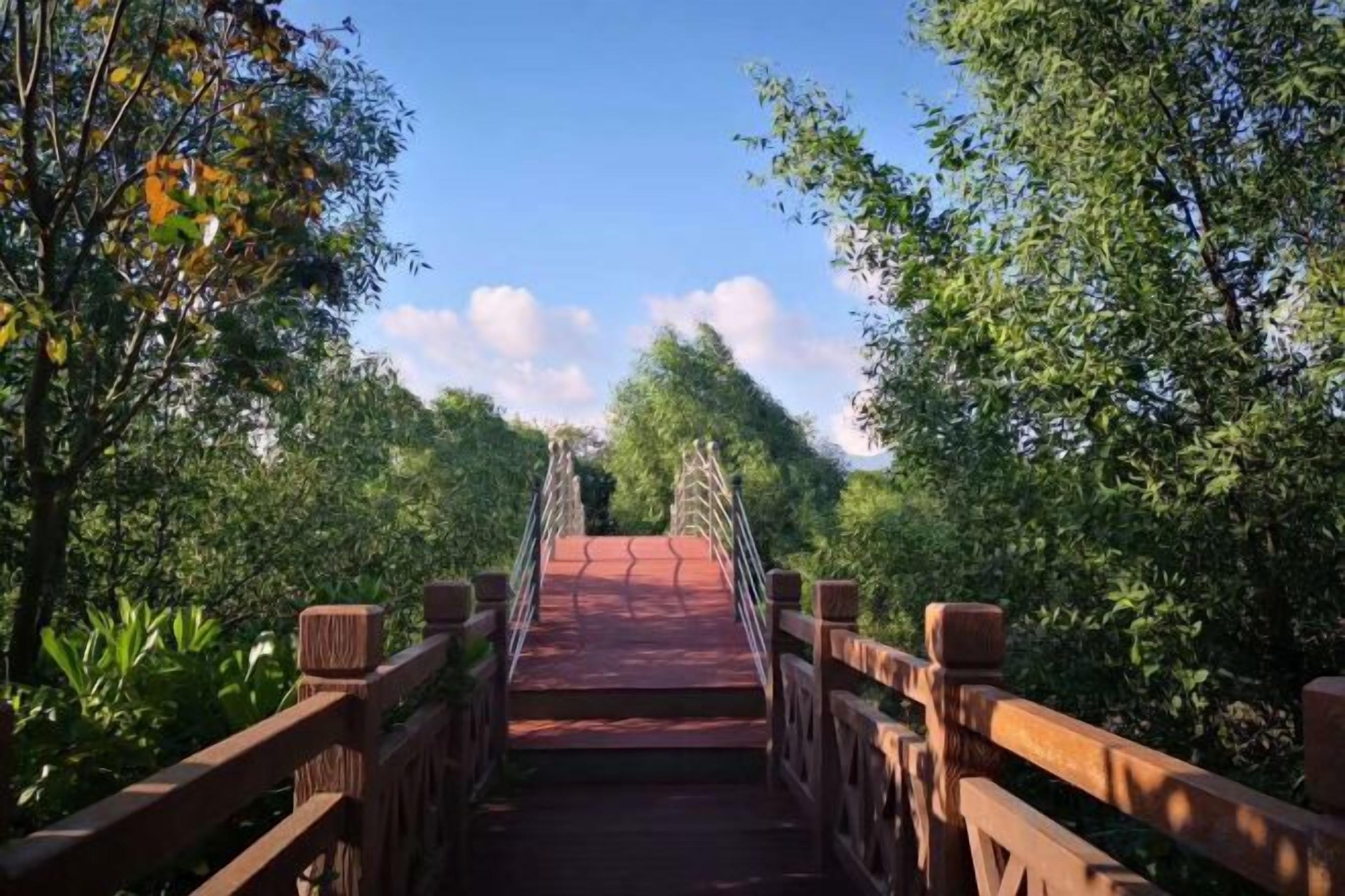 A wooden bridge with railings, surrounded by greenery.