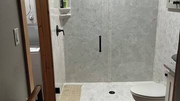 Shower, hair dryer, towels, soap