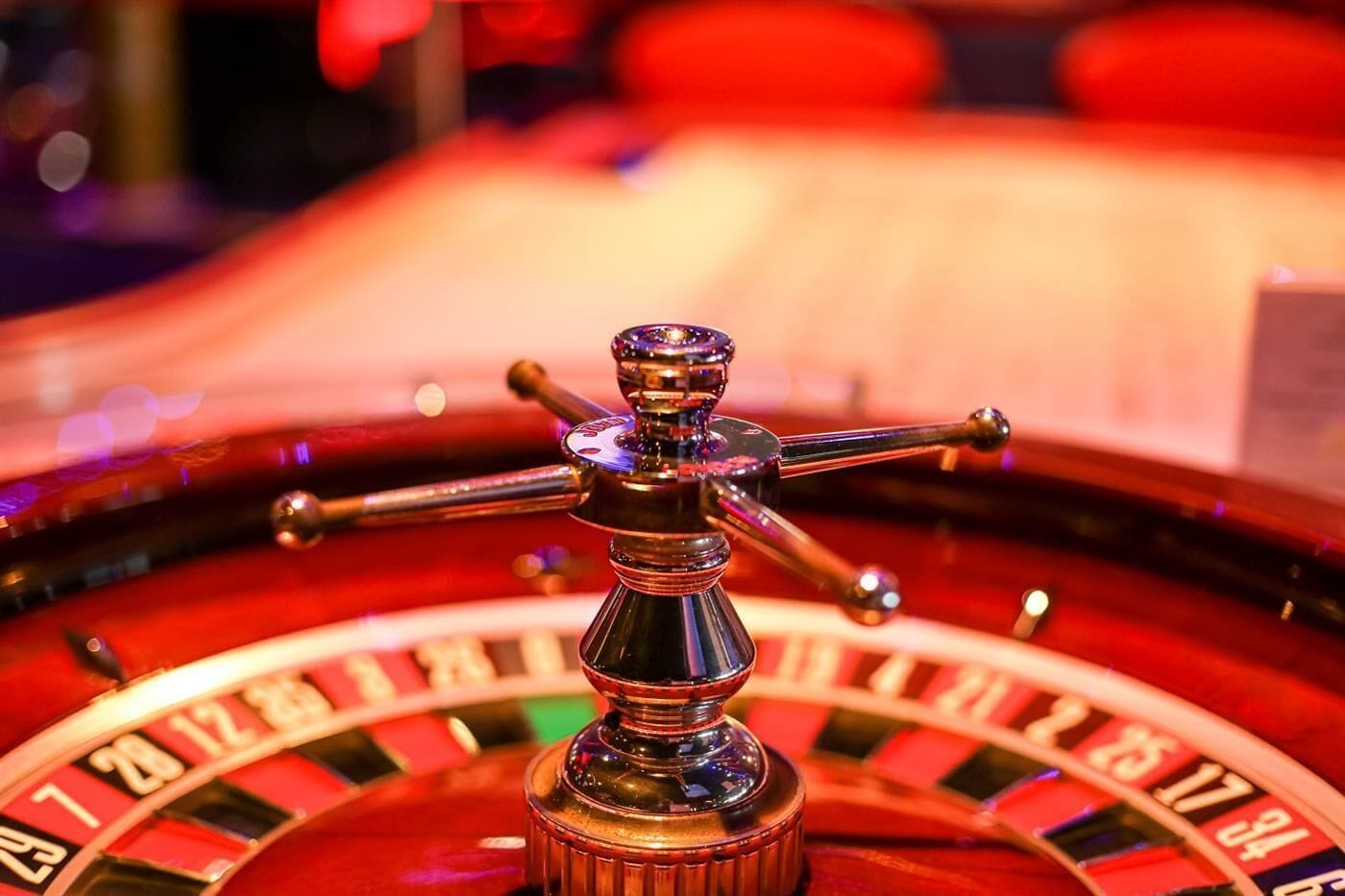 A roulette wheel with a central spinning wheel and multiple betting options.