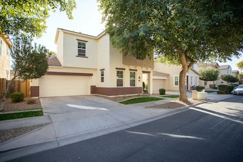 View from the left showing garage and driveway