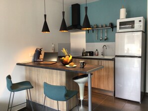 Fridge, microwave, stovetop, coffee/tea maker