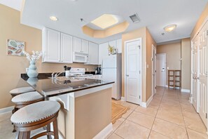 Fridge, microwave, oven, stovetop - Beach Front Condo | Waterspouts + Zero Entry Pool | Lighthouse | My Beach Getaways (Gulf Shores)