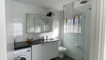 Shower, hair dryer, towels, soap