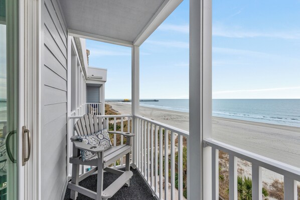 A balcony with a view of the beach and ocean. - Recently Renovated, oceanfront condo + Free Attraction Tickets! (Myrtle Beach)