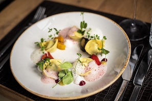 Savor a beautifully presented dish at this fine dining table.
