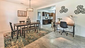 A modern kitchen with dark cabinets, a microwave, and a coffee machine. - Bright, Pet-Friendly Retreat in Avon Park! (Avon Park)