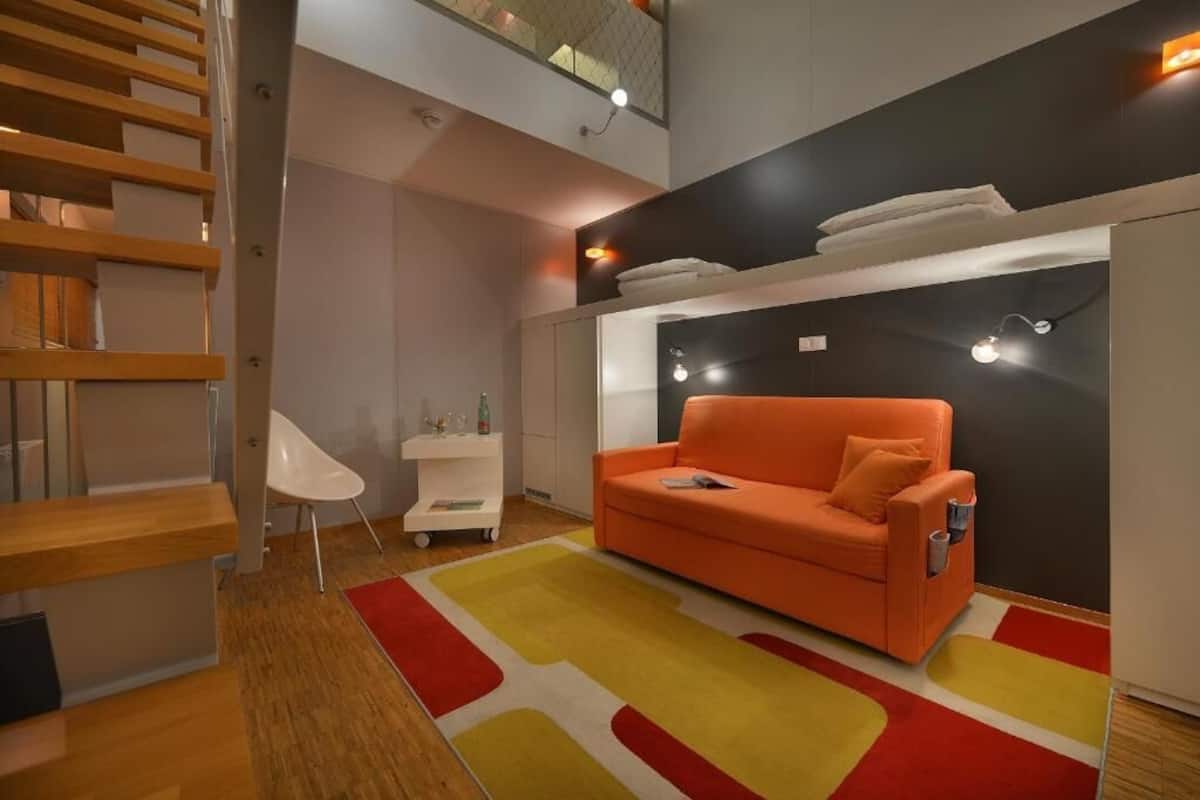 Maisonnette, balkon | 1 slaapkamer, een minibar, een kluis op de kamer, een bureau