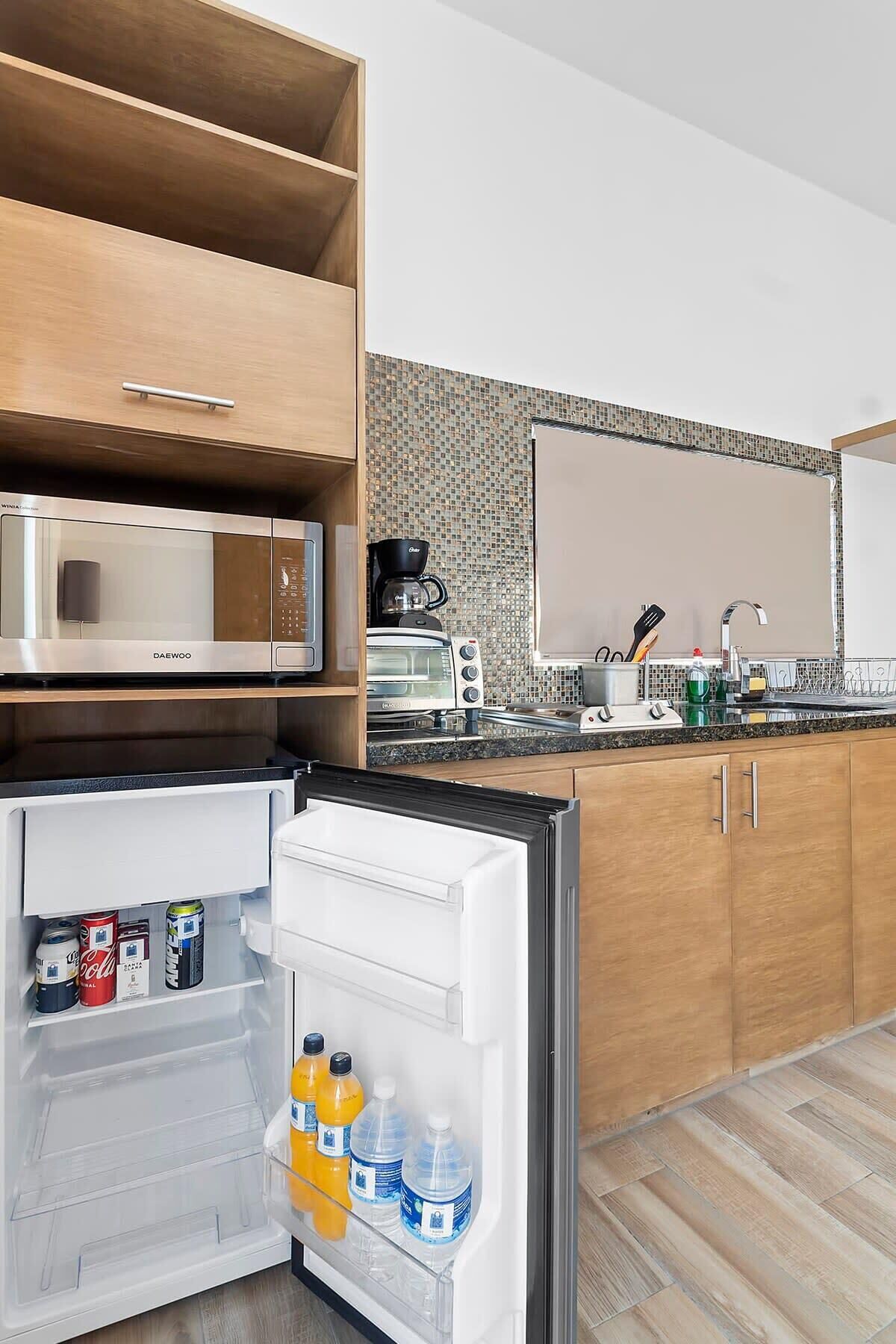 Fridge, microwave, stovetop, coffee/tea maker