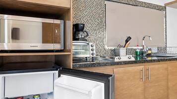 Fridge, microwave, stovetop, coffee/tea maker