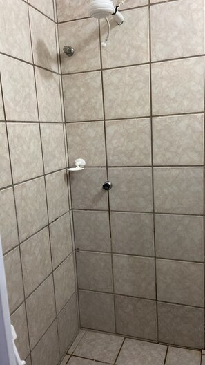Shower, hair dryer, towels, toilet paper