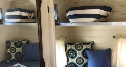 Glamping with sheep in a renovated 1972 Ace camper on 48 acres