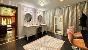 A room with a vanity, two mirrors, a chandelier, a large mirror, and a patterned rug. - Romantic Suite 500 sq ft. of privacy (Mount Pleasant)