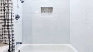 Bathtub, hair dryer, towels