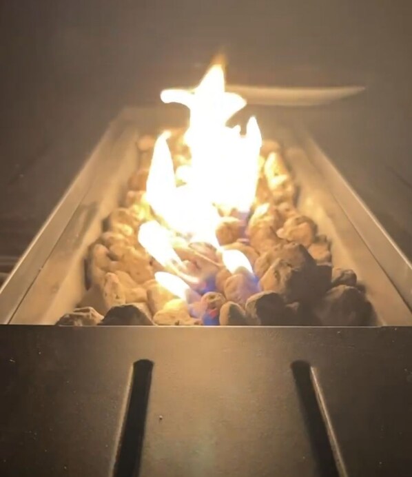 A close-up of a fire burning in a fireplace with visible logs and flames. - Fall is here cozy firepit walk everywhere deck
 baby gear 4k 65' tv for game day (Cape May Court House)