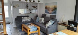 Een smart-tv, een open haard, een dvd-speler en een filmbibliotheek