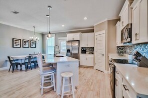 Microwave, dishwasher, coffee/tea maker, cookware/dishes/utensils