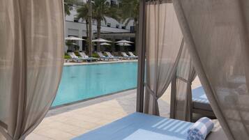 Outdoor pool, open 7:00 AM to 7:00 PM, pool cabanas (surcharge)