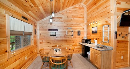 Double cabin with 2 queen beds, 1 king bed, common porch and each unit has a private entrance and bath.