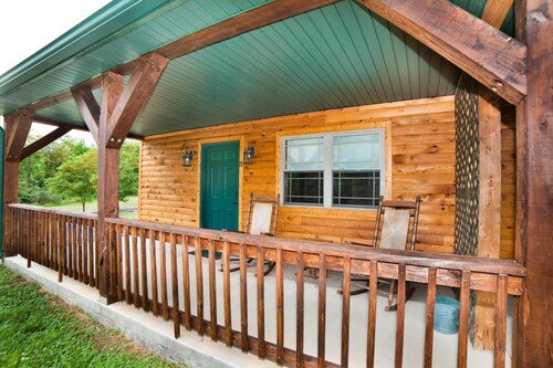Double cabin with 2 queen beds, 1 king bed, common porch and each unit has a private entrance and bath.