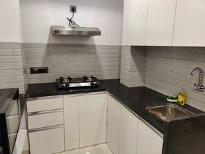 Fridge, microwave, stovetop, cookware/dishes/utensils