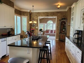 Microwave, dishwasher, coffee/tea maker, cookware/dishes/utensils