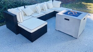 A sectional sofa with white cushions and a square fire pit table. - 3 Bed 2 Ba, Wifi, Kitchen, Walk to Beach, FirePit (Daytona Beach)