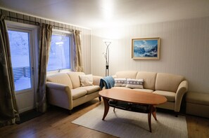 TV, fireplace - View of the Fjord and Segla (Fjordgård)