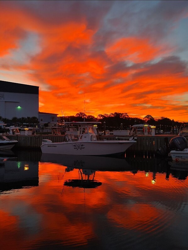 Enjoy waterfront views from the marina, where a boat is docked and a nearby building offers a convenient location.