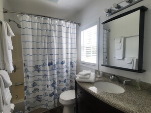 Combined shower/bathtub, hair dryer, towels, soap - Bright and airy waterfront getaway (Benedict)