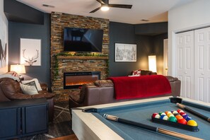 Smart TV, fireplace, foosball
