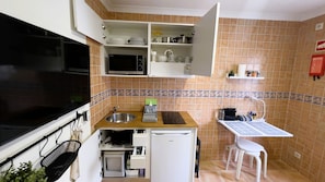 Fridge, microwave, stovetop, coffee/tea maker