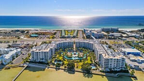 A resort with a central pool, multiple buildings, and a beach. - Destin West Osprey 604  ~ 3BR w/ Bay & Lazy River Views! (Fort Walton Beach)