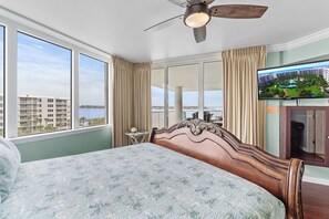 Relax in this serene room with a large bed, scenic views, and a flat-screen TV.
