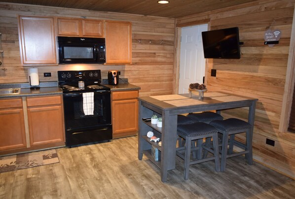 Enjoy cooking in this well-equipped kitchen with an oven, stovetop, and microwave.