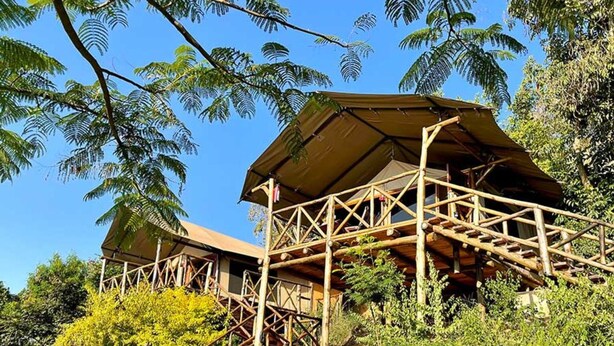 A wooden structure with a covered upper level, surrounded by greenery and rocks. - Jangwani Camp Sagana (Murang'a)
