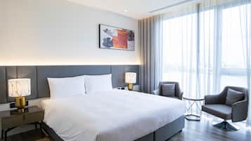 Deluxe Suite, 2 Bedrooms | Hypo-allergenic bedding, down comforters, in-room safe, blackout drapes